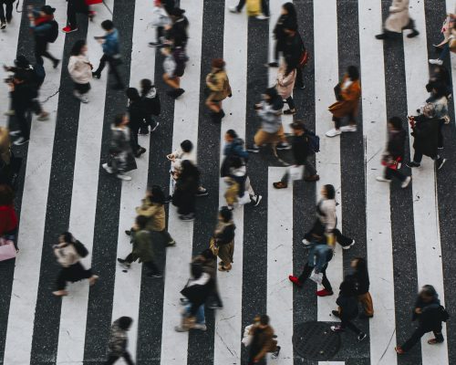 Pedestrians crossing a crosswalk in Shibuya, Japan Pedestrians crossing a crosswalk in Shibuya, Japan